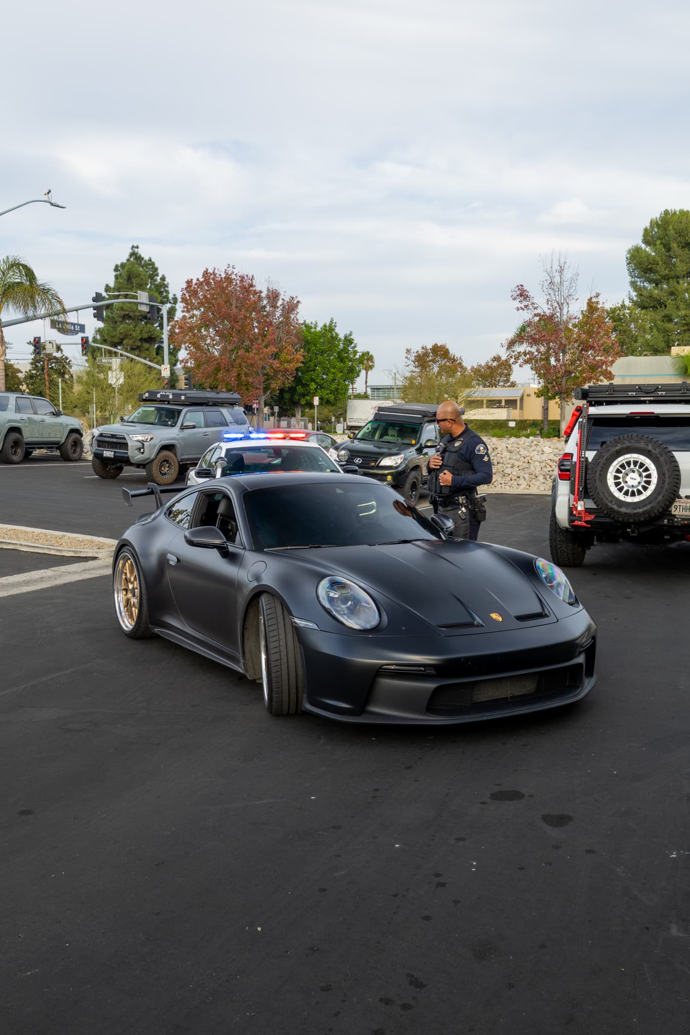 Black BMW performance sedan photographed in a quiet lot